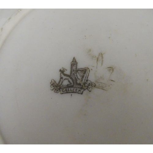 51 - Belleek tea wares in the Grass pattern to include teapots, milk jug, cream jug, teapot stand, saucer... 