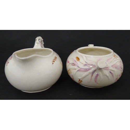 51 - Belleek tea wares in the Grass pattern to include teapots, milk jug, cream jug, teapot stand, saucer... 