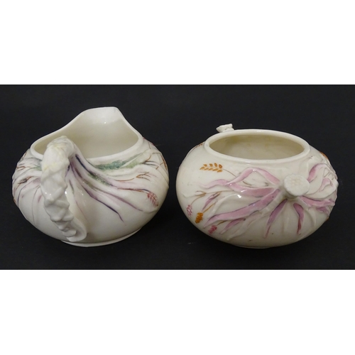 51 - Belleek tea wares in the Grass pattern to include teapots, milk jug, cream jug, teapot stand, saucer... 