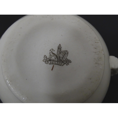 51 - Belleek tea wares in the Grass pattern to include teapots, milk jug, cream jug, teapot stand, saucer... 