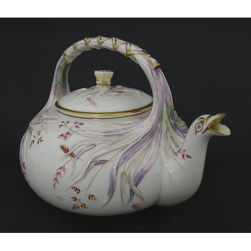 51 - Belleek tea wares in the Grass pattern to include teapots, milk jug, cream jug, teapot stand, saucer... 