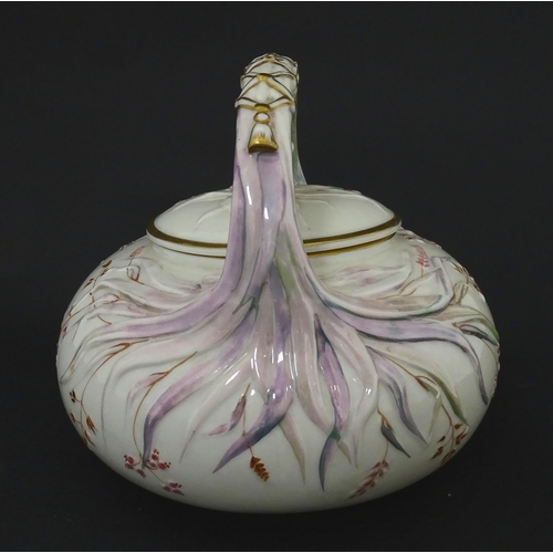 51 - Belleek tea wares in the Grass pattern to include teapots, milk jug, cream jug, teapot stand, saucer... 