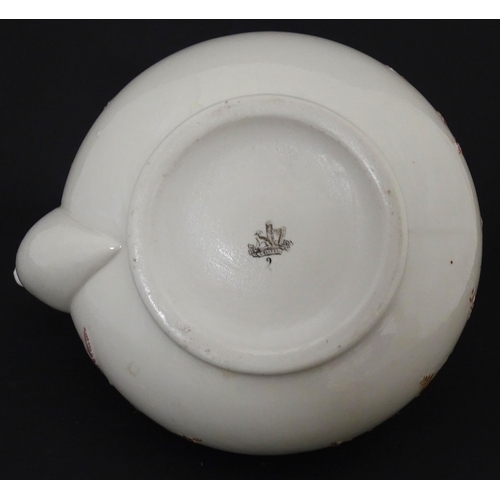 51 - Belleek tea wares in the Grass pattern to include teapots, milk jug, cream jug, teapot stand, saucer... 