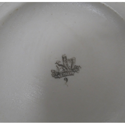 51 - Belleek tea wares in the Grass pattern to include teapots, milk jug, cream jug, teapot stand, saucer... 