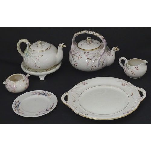 51 - Belleek tea wares in the Grass pattern to include teapots, milk jug, cream jug, teapot stand, saucer... 