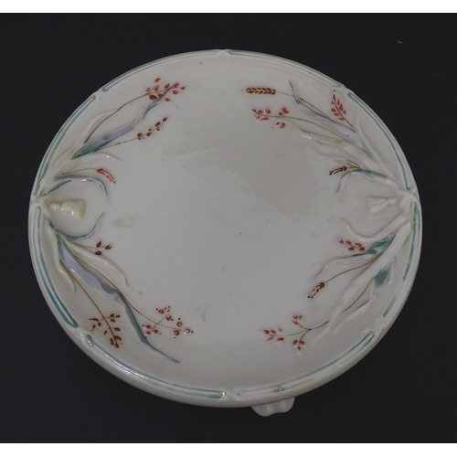 51 - Belleek tea wares in the Grass pattern to include teapots, milk jug, cream jug, teapot stand, saucer... 