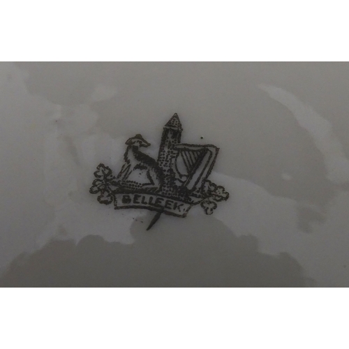 51 - Belleek tea wares in the Grass pattern to include teapots, milk jug, cream jug, teapot stand, saucer... 