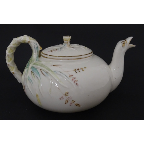 51 - Belleek tea wares in the Grass pattern to include teapots, milk jug, cream jug, teapot stand, saucer... 