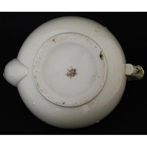 51 - Belleek tea wares in the Grass pattern to include teapots, milk jug, cream jug, teapot stand, saucer... 