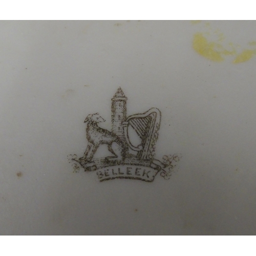 51 - Belleek tea wares in the Grass pattern to include teapots, milk jug, cream jug, teapot stand, saucer... 