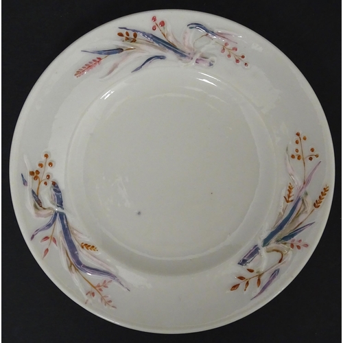 51 - Belleek tea wares in the Grass pattern to include teapots, milk jug, cream jug, teapot stand, saucer... 