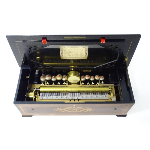 1268 - A 19thC Samuel Troll of Geneva musical box / music box with an unusually long cylinder, with ten eng... 