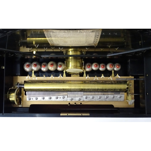 1268 - A 19thC Samuel Troll of Geneva musical box / music box with an unusually long cylinder, with ten eng... 
