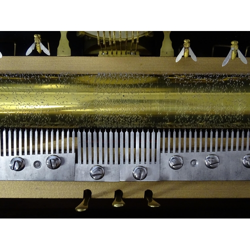 1268 - A 19thC Samuel Troll of Geneva musical box / music box with an unusually long cylinder, with ten eng... 