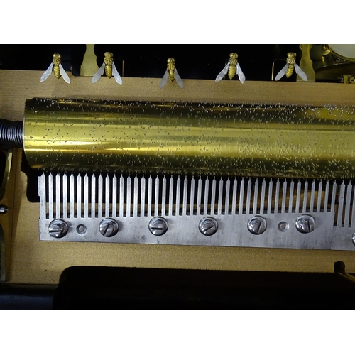 1268 - A 19thC Samuel Troll of Geneva musical box / music box with an unusually long cylinder, with ten eng... 