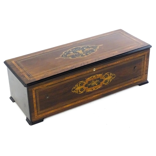 1268 - A 19thC Samuel Troll of Geneva musical box / music box with an unusually long cylinder, with ten eng... 