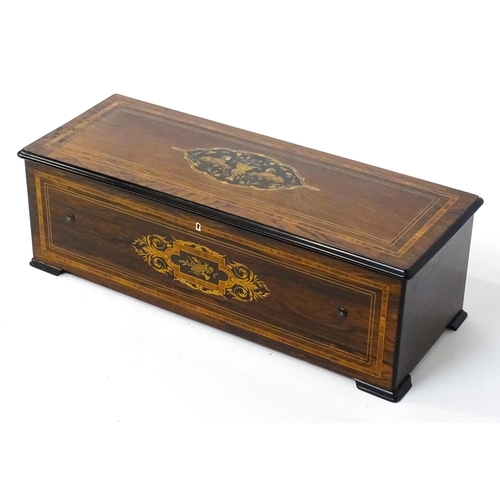 1268 - A 19thC Samuel Troll of Geneva musical box / music box with an unusually long cylinder, with ten eng... 
