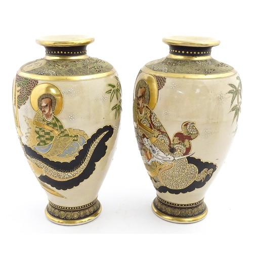 56 - A pair of Japanese satsuma vases decorated with Immortal figures. Character marks under. Approx. 12 ... 