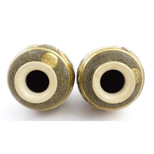 56 - A pair of Japanese satsuma vases decorated with Immortal figures. Character marks under. Approx. 12 ... 