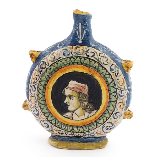 69 - An Italian maiolica pilgrim flask, each side decorated with a portrait medallion within banded borde... 