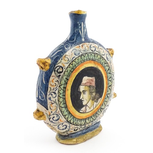 69 - An Italian maiolica pilgrim flask, each side decorated with a portrait medallion within banded borde... 