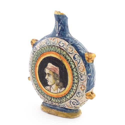 69 - An Italian maiolica pilgrim flask, each side decorated with a portrait medallion within banded borde... 