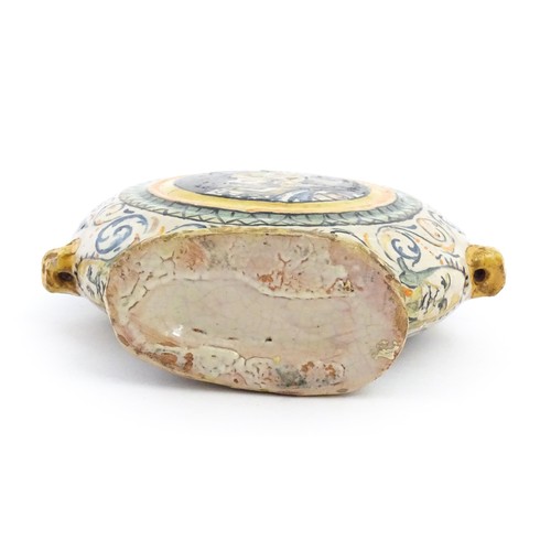 69 - An Italian maiolica pilgrim flask, each side decorated with a portrait medallion within banded borde... 