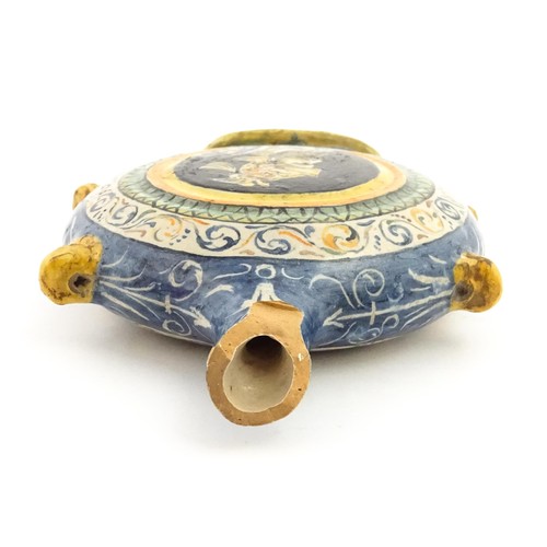 69 - An Italian maiolica pilgrim flask, each side decorated with a portrait medallion within banded borde... 