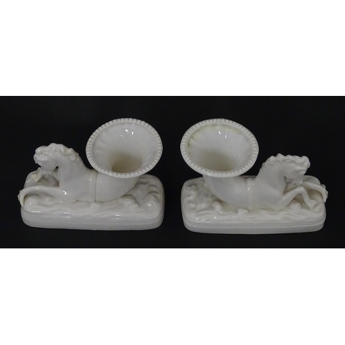 89 - A matched pair of Belleek Seahorse flower holders / vases. One with impressed First Period mark, the... 