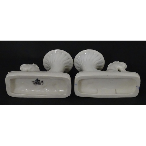 89 - A matched pair of Belleek Seahorse flower holders / vases. One with impressed First Period mark, the... 