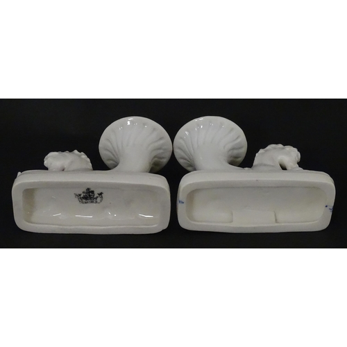 89 - A matched pair of Belleek Seahorse flower holders / vases. One with impressed First Period mark, the... 