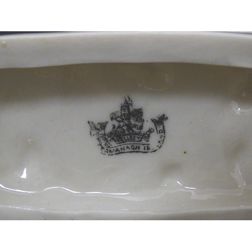 89 - A matched pair of Belleek Seahorse flower holders / vases. One with impressed First Period mark, the... 