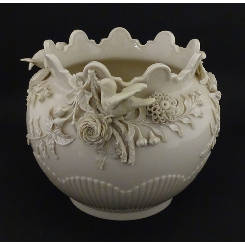 90 - A Belleek Rathmore jardiniere / planter decorated with birds, flowers and foliage. Marked with Secon... 