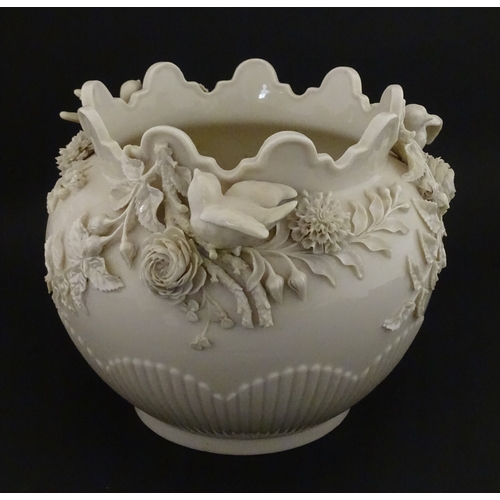 90 - A Belleek Rathmore jardiniere / planter decorated with birds, flowers and foliage. Marked with Secon... 