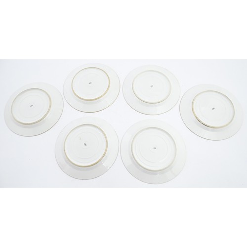 77 - Six hand painted desert plates, each decorated with flowers and foliage, with turquoise and gilt bor... 