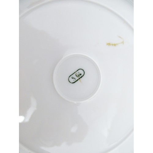 77 - Six hand painted desert plates, each decorated with flowers and foliage, with turquoise and gilt bor... 