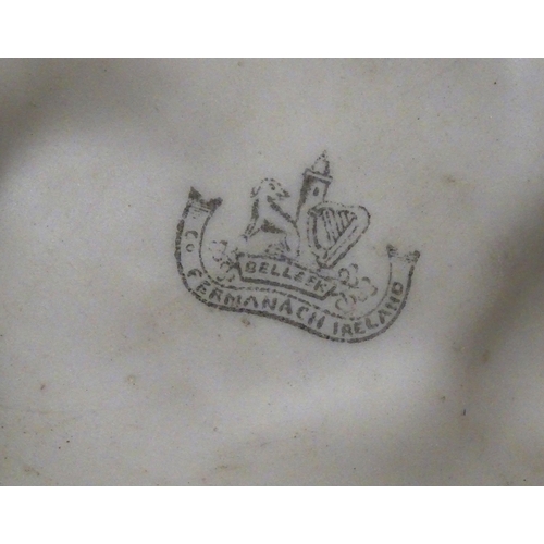 98 - A Belleek Bird Nest Stump vase with floral, foliate and bird decoration. Marked under with Second Pe... 