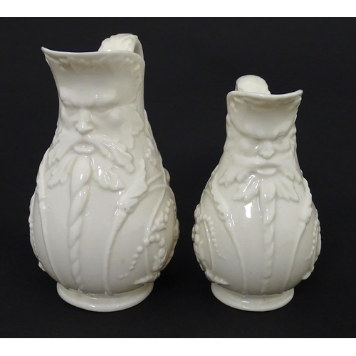 100 - Two Belleek jugs in the Bearded Mask pattern. Both marked with First Period mark under. Largest appr... 