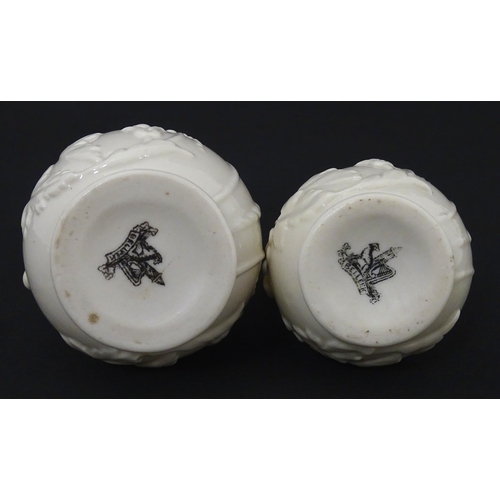 100 - Two Belleek jugs in the Bearded Mask pattern. Both marked with First Period mark under. Largest appr... 