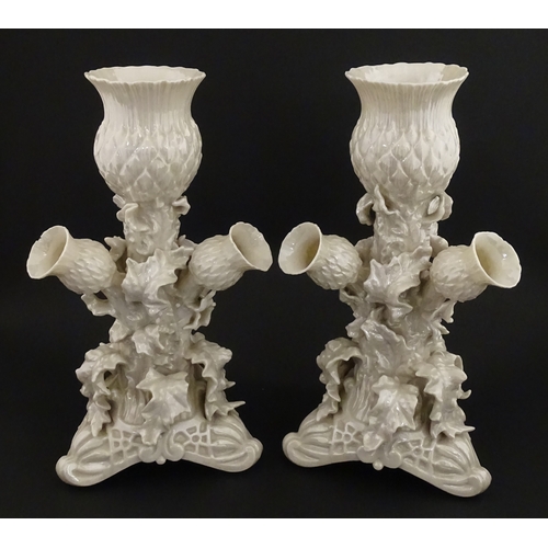102 - A pair of Belleek Thistle vases with lustre detail. Marked with Second Period mark under. Approx. 10... 