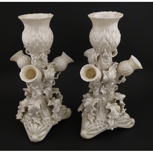 102 - A pair of Belleek Thistle vases with lustre detail. Marked with Second Period mark under. Approx. 10... 