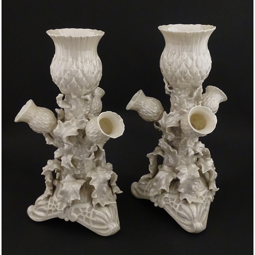 102 - A pair of Belleek Thistle vases with lustre detail. Marked with Second Period mark under. Approx. 10... 
