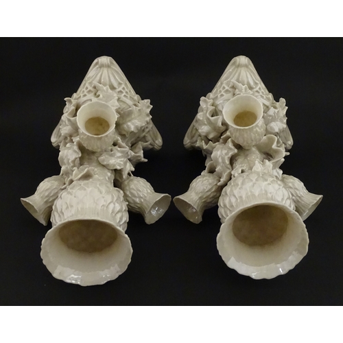 102 - A pair of Belleek Thistle vases with lustre detail. Marked with Second Period mark under. Approx. 10... 