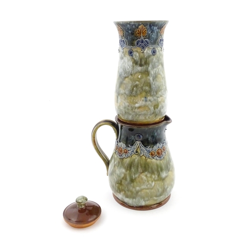 106 - A Royal Doulton stoneware water filter and jug with lid, the mottled green glaze with scrolling and ... 