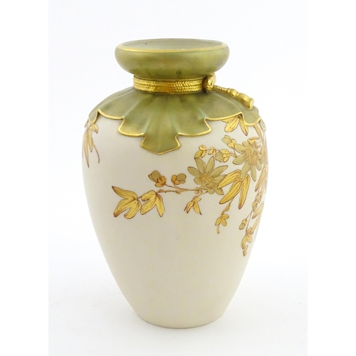 111 - A Royal Worcester vase with gilt passion flower and foliate decoration, the top with stylised tied d... 