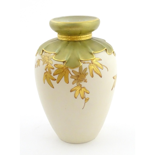 111 - A Royal Worcester vase with gilt passion flower and foliate decoration, the top with stylised tied d... 