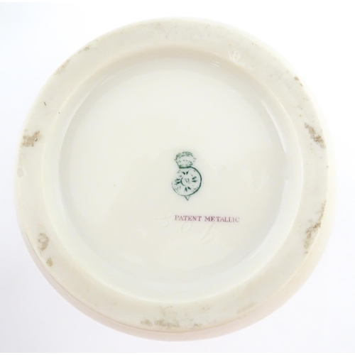 111 - A Royal Worcester vase with gilt passion flower and foliate decoration, the top with stylised tied d... 