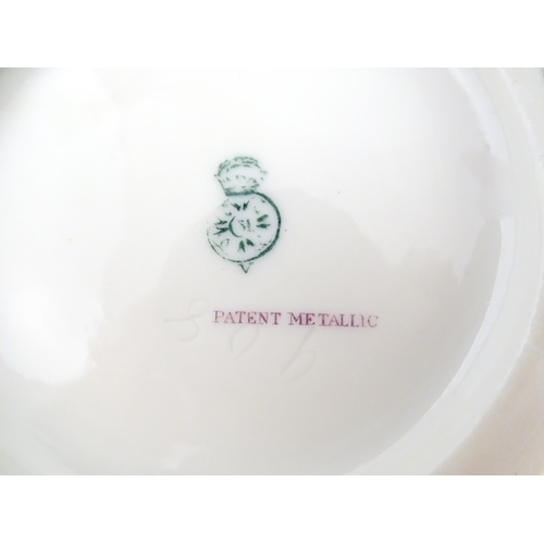 111 - A Royal Worcester vase with gilt passion flower and foliate decoration, the top with stylised tied d... 