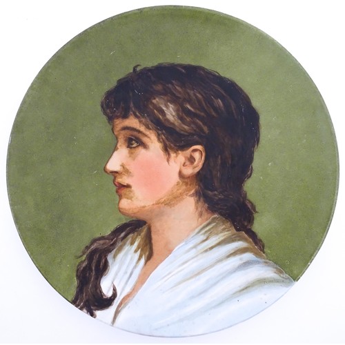 74 - A Brown Westhead / Moore & Co hand painted charger depicting a portrait. Impressed marks under. Appr... 