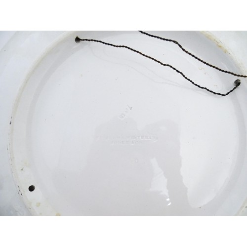 74 - A Brown Westhead / Moore & Co hand painted charger depicting a portrait. Impressed marks under. Appr... 